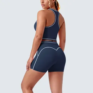 Detailed rear view of a navy blue brushed racerback yoga set with white contrast piping.