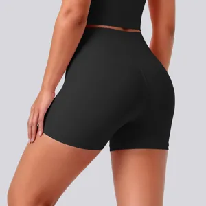 High-waisted black yoga shorts detail, seamless athletic activewear for fitness and running.