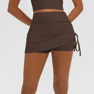 Detailed view of brown ruched yoga skort, high waist stretchy fitness athletic skirt activewear