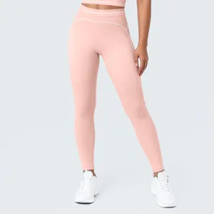 Mallas deportivas rosas de tiro alto con detalles en contraste para fitness y yoga.
