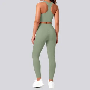Solid color activewear set featuring a supportive racerback sports bra and high-waist yoga leggings.
