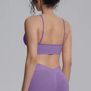 Detailed rear view showing the back straps and seamless texture of purple sports bra.
