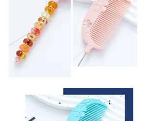 Close-up details of the colorful beaded handle and fine-tooth comb with floral motifs.