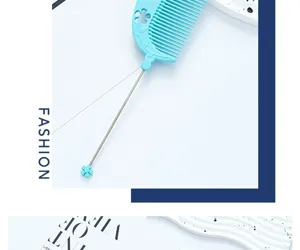Close-up detail of blue plastic tail comb with fine teeth and flower ornament for hair styling.