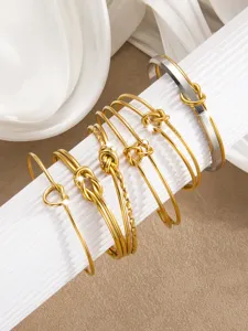 Modische Titanstahl Gold Knoten Armreifen, minimalistische offene Armbänder für Damen.