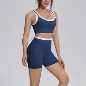 Two-piece activewear set featuring a contrast trim sports bra and high-waist yoga shorts.