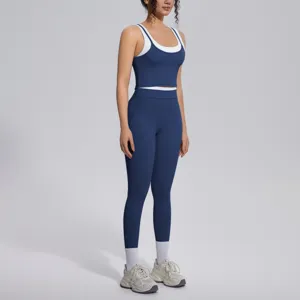 Dark blue two-piece activewear set, contrast white inner layer tank top and high waist leggings.