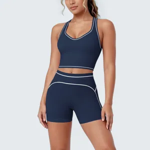 Detailed shot of dark blue activewear set, racerback sports bra and high-waisted shorts.