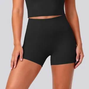 Close-up detail of black high-waist stretchy yoga shorts, breathable fabric for fitness workouts.