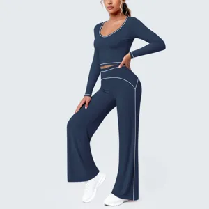 Dunkelblaue Langarm Crop Top und Schlag Yoga Hosen Set mit stilvollem weißen Paspelrand.
