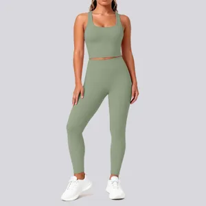 Sage green activewear set, ribbed crop top and high waist fitness leggings detail view.