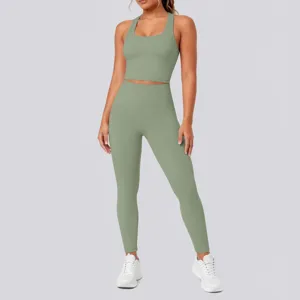 Seamless high waist yoga pants and sports bra detail view, comfortable stretch activewear fabric.