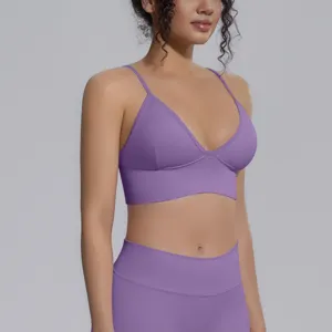 Seamless purple yoga bra detail, breathable stretch fitness sportswear top for running and gym.