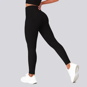 High waist solid black yoga leggings detail view, featuring hip lifting and stretchy fit.