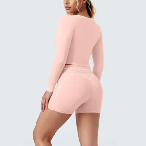Pink contrast long sleeve crop top shorts yoga set for women active fitness running gym apparel.
