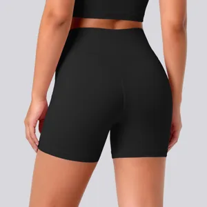 Detailed view of black high waist yoga shorts, showing elastic stretch fabric and fitness.
