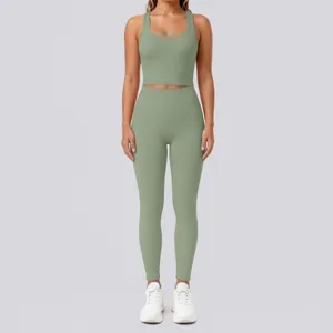 Detailed view of women activewear set, sage green crop top and high waist leggings.