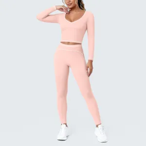 Pink long sleeve crop top yoga set with white trim, tight workout activewear for women fitness.
