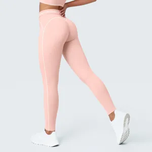Detalles leggings yoga rosa talle alto con líneas contraste, pantalón fitness nude transpirable.