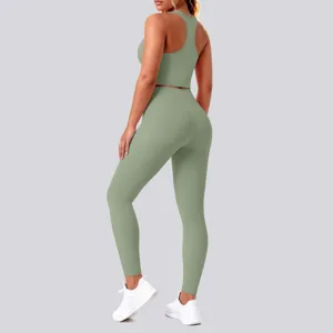 Back view detail of a solid sage green yoga set featuring a racerback crop top and leggings.