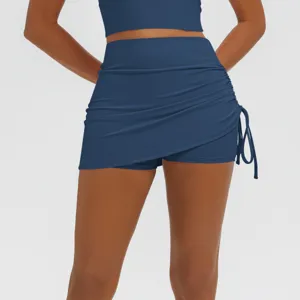 Dark blue athletic yoga skort with side drawstring, high waist fitness activewear running skirt.