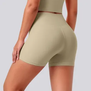 Detail view of high-waisted seamless nude yoga shorts in khaki, breathable stretch activewear.