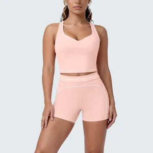 Close-up detail of the pink yoga activewear set, showcasing brushed fabric and piping.