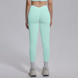 Detail view of mint green seamless high waist yoga leggings with scrunch butt lift design.