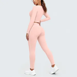 Detailed view of pink seamless fitness yoga set with white piping, highlighting soft brushed fabric texture.