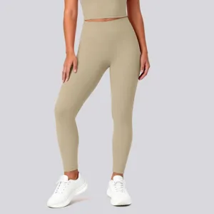 High-waisted seamless yoga leggings detail, showing solid color texture and lift fit.