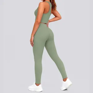 Detail view of women solid green sports bra and leggings yoga set, perfect for fitness workouts.