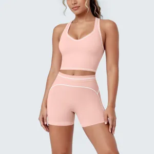 Detail view of women pink activewear set with contrast piping for fitness yoga gym training workouts.
