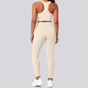 Back view of women beige ribbed seamless sports bra and high waist yoga pants activewear set.