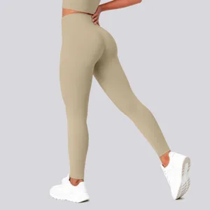 Detail view of high waist hip lifting plain athletic leggings showing supportive fit and stretch.