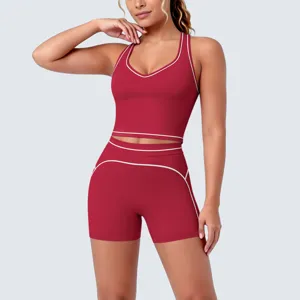 Red athletic yoga set featuring a racerback sports bra and matching piped shorts for women.