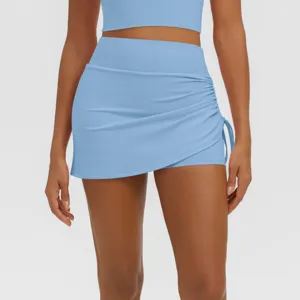 Light blue athletic fitness skort detail featuring high waist and side ruching design.