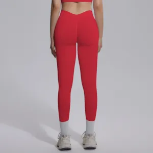 Back detail view of seamless high-waist stretchy sports yoga leggings in vibrant red.