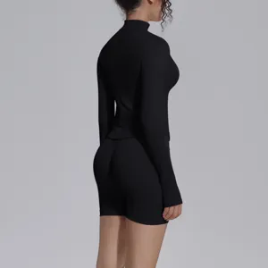 Black seamless long sleeve top and shorts activewear set for fitness, yoga, running workouts.