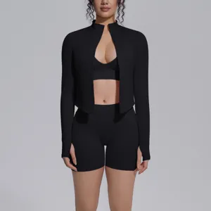Close-up detail of the black seamless activewear set with zip jacket, bra and shorts.