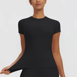 Detail view of women quick drying black athletic t shirt, slim fit short sleeve yoga top.