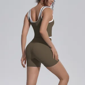 Breathable two-piece yoga set detail featuring a contrasting strap crop top and matching shorts.