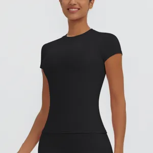 Detail view of women's black quick dry short sleeve sports top, fitness and yoga wear.
