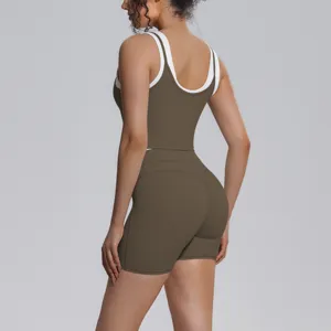 Women two-piece yoga set back view, activewear long tank top and tight fitness shorts.