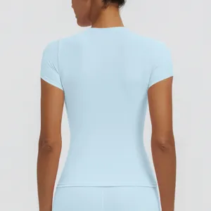 Back view detail of light blue short sleeve yoga top athletic fitness running shirt woman