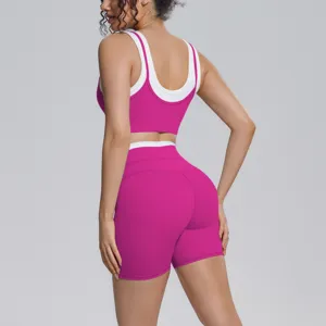 Detail view of hot pink dual-side nylon sports bra and shorts activewear set for fitness running.