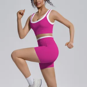 Detail view of the pink and white colorblocked activewear set, showcasing the athletic fit.