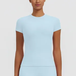 Close-up detail shot of women light blue slim fit short sleeve quick dry sports fitness top.