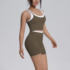 Women two-piece athletic yoga set featuring a contrast layered tank top and high-waisted shorts.