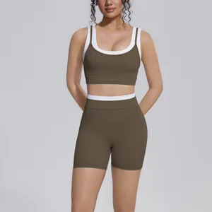 Details view of a stylish two-piece athletic yoga set in brown and white color block design.