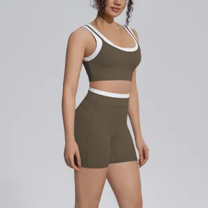 Seamless two-piece activewear set featuring a contrast trim sports bra and high-waist shorts.